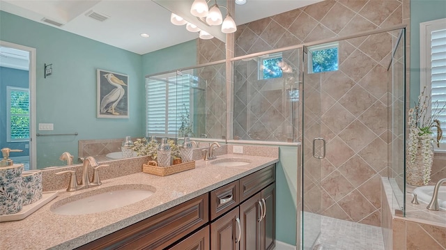 11603 Bluebird Pl, Lakewood Ranch, FL 34211 - bathroom featuring double vanity, a garden tub, and a shower stall