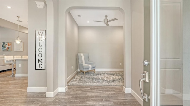 11603 Bluebird Pl, Lakewood Ranch, FL 34211 - entryway featuring wood finished floors, baseboards, a ceiling fan, arched walkways, and recessed lighting