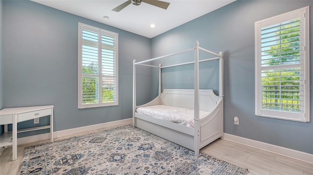 11603 Bluebird Pl, Lakewood Ranch, FL 34211 - bedroom featuring multiple windows, baseboards, and ceiling fan