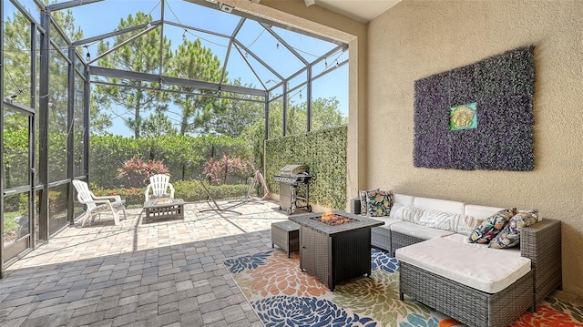 11603 Bluebird Pl, Lakewood Ranch, FL 34211 - view of patio / terrace with grilling area, a lanai, and an outdoor living space with a fire pit