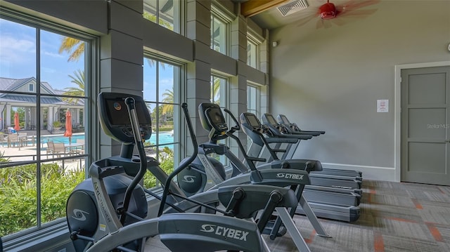 11603 Bluebird Pl, Lakewood Ranch, FL 34211 - workout area with ceiling fan, carpet, a towering ceiling, and baseboards