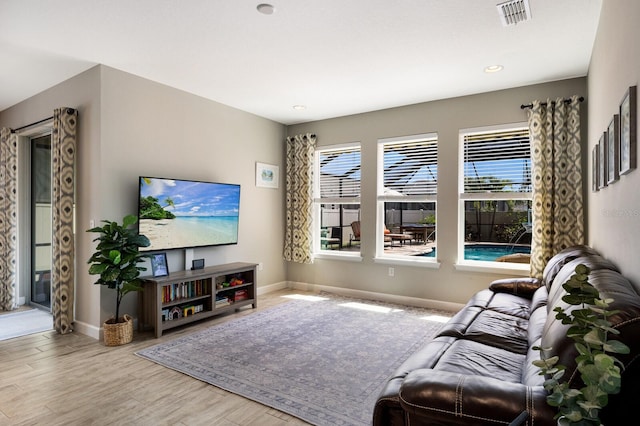 11411 Spring Gate Trl, Bradenton, FL 34211 - living room with baseboards, wood finished floors, and recessed lighting