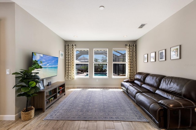 11411 Spring Gate Trl, Bradenton, FL 34211 - living area featuring wood finished floors, baseboards, and recessed lighting