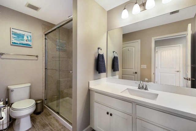 11411 Spring Gate Trl, Bradenton, FL 34211 - full bath featuring toilet, vanity, a stall shower, and tile patterned flooring