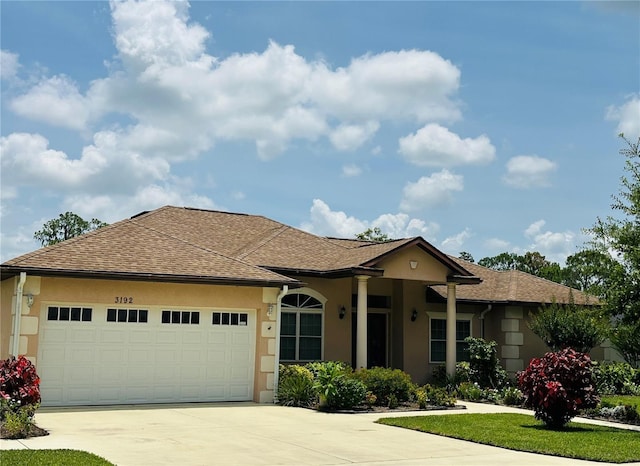 3192 Oaks Bnd, Bowling Green, FL 33834 - single story home with driveway, an attached garage, stucco siding, and roof with shingles