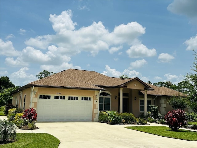3192 Oaks Bnd, Bowling Green, FL 33834 - single story home with driveway, an attached garage, and stucco siding