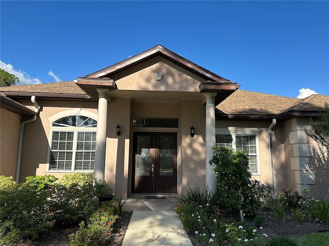 3192 Oaks Bnd, Bowling Green, FL 33834 - entrance to property featuring stucco siding, french doors, and roof with shingles