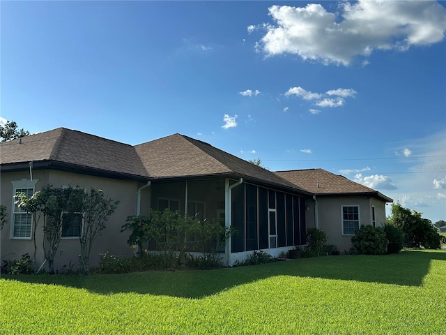 3192 Oaks Bnd, Bowling Green, FL 33834 - back of property featuring a yard, a sunroom, and stucco siding