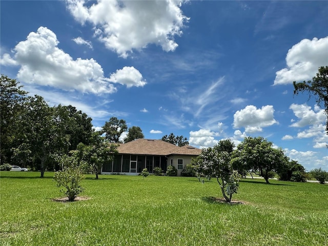 3192 Oaks Bnd, Bowling Green, FL 33834 - view of green lawn with a sunroom