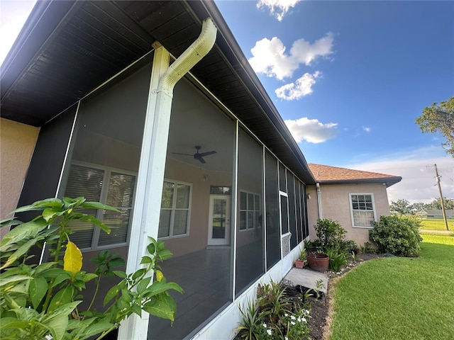 3192 Oaks Bnd, Bowling Green, FL 33834 - view of home's exterior with a sunroom, stucco siding, and a yard