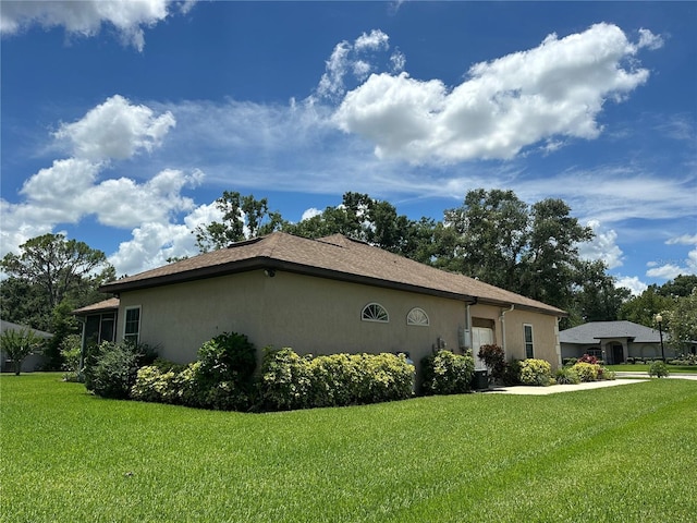 3192 Oaks Bnd, Bowling Green, FL 33834 - view of home's exterior featuring a lawn and stucco siding