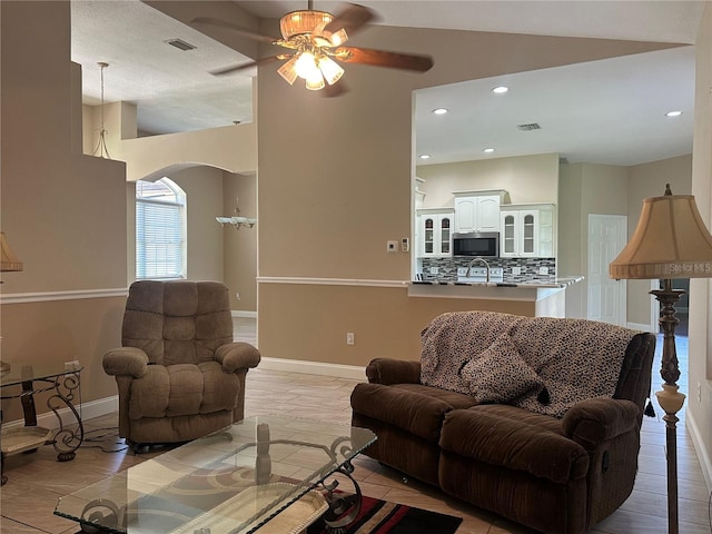 3192 Oaks Bnd, Bowling Green, FL 33834 - living area with ceiling fan, arched walkways, light tile patterned floors, and recessed lighting