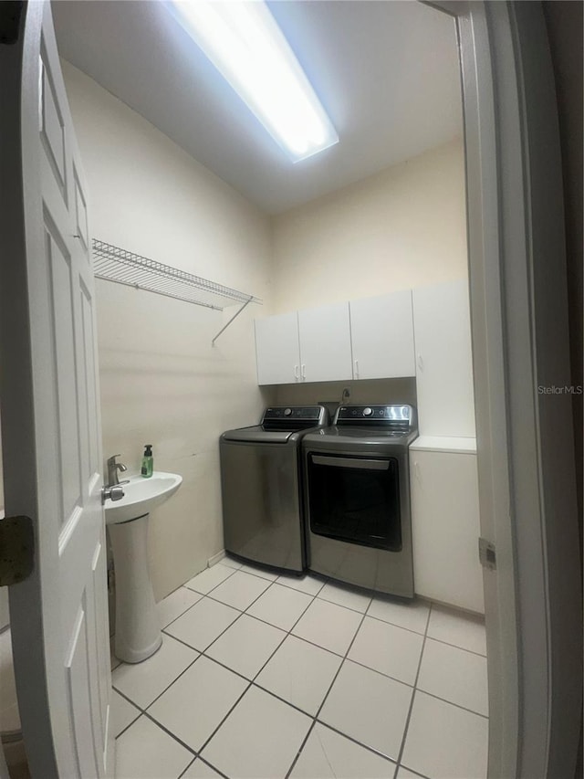 3192 Oaks Bnd, Bowling Green, FL 33834 - laundry room with independent washer and dryer, light tile patterned floors, and cabinet space