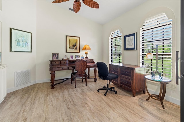 7331 Villa D Este Dr, Sarasota, FL 34238 - home office featuring light wood finished floors, a ceiling fan, baseboards, and lofted ceiling