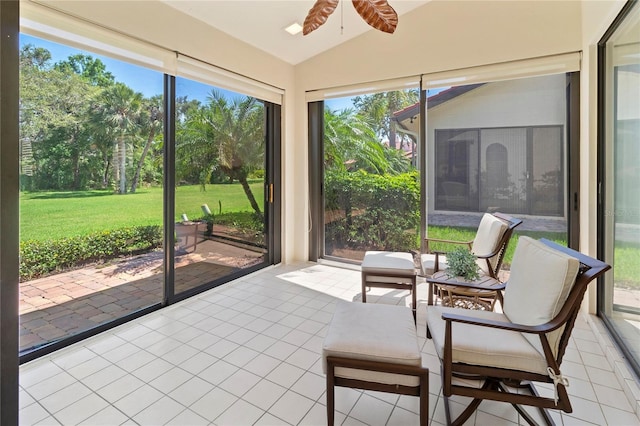 7331 Villa D Este Dr, Sarasota, FL 34238 - sunroom / solarium featuring lofted ceiling, a ceiling fan, tile patterned floors, and plenty of natural light