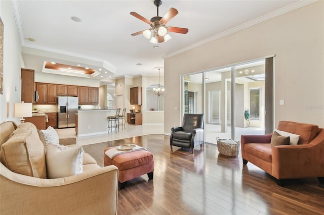 9008 Brookfield Ter, Bradenton, FL 34212 - living area with crown molding, wood-type flooring, a chandelier, ceiling fan, and recessed lighting