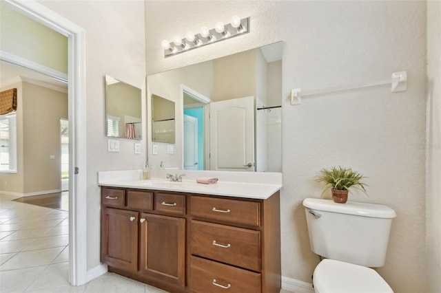 9008 Brookfield Ter, Bradenton, FL 34212 - bathroom with tile patterned flooring, vanity, toilet, and baseboards
