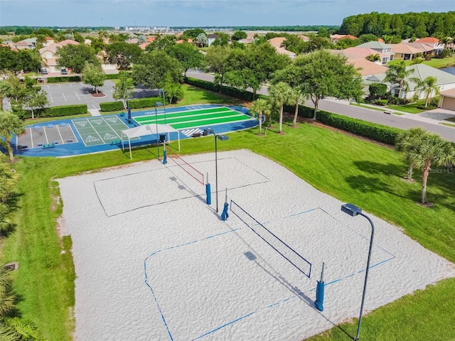 9008 Brookfield Ter, Bradenton, FL 34212 - surrounding community with volleyball court, shuffleboard, a yard, and a residential view