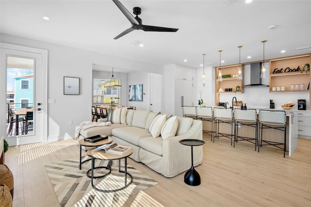 103 4th St N Unit A, Bradenton Beach, FL 34217 - living room featuring ceiling fan, light wood finished floors, and recessed lighting
