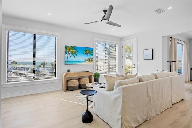 103 4th St N Unit A, Bradenton Beach, FL 34217 - living area featuring wood finished floors, plenty of natural light, ceiling fan, and recessed lighting