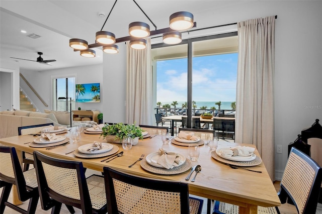 103 4th St N Unit A, Bradenton Beach, FL 34217 - dining room with ceiling fan and stairway