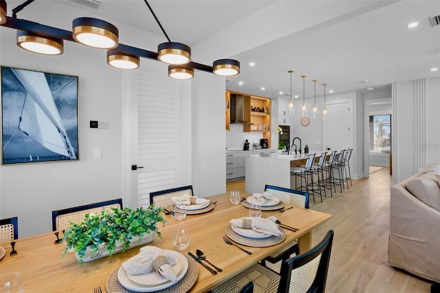 103 4th St N Unit A, Bradenton Beach, FL 34217 - dining room with light wood finished floors and recessed lighting