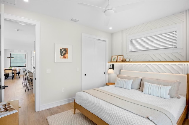 103 4th St N Unit A, Bradenton Beach, FL 34217 - bedroom with a closet, light wood-style flooring, multiple windows, baseboards, and recessed lighting