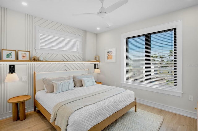 103 4th St N Unit A, Bradenton Beach, FL 34217 - bedroom with multiple windows, wood finished floors, and recessed lighting