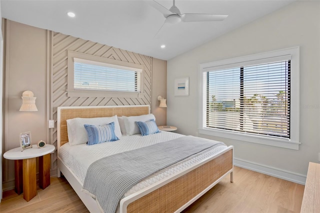 103 4th St N Unit A, Bradenton Beach, FL 34217 - bedroom with light wood-style flooring, vaulted ceiling, recessed lighting, ceiling fan, and baseboards