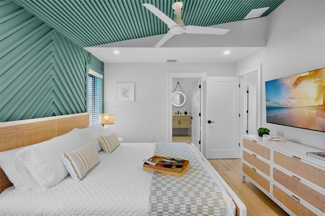 103 4th St N Unit A, Bradenton Beach, FL 34217 - bedroom featuring light wood-style floors, recessed lighting, connected bathroom, and ceiling fan