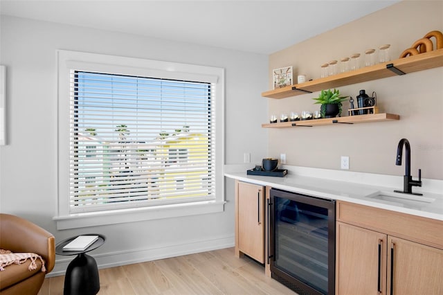 103 4th St N Unit A, Bradenton Beach, FL 34217 - indoor bar featuring wine cooler, plenty of natural light, light wood-style flooring, and baseboards