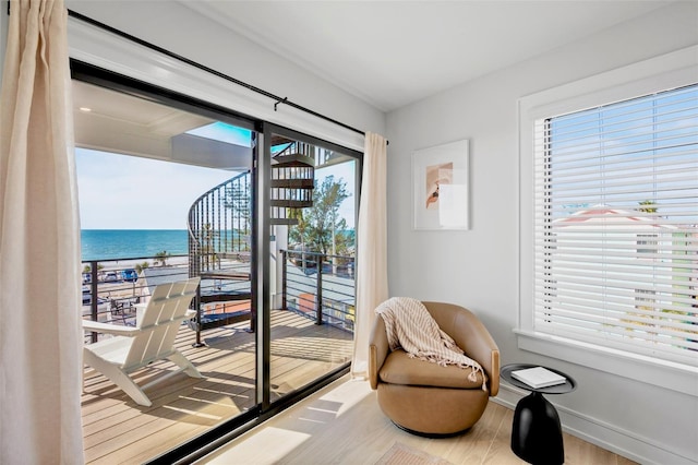 103 4th St N Unit A, Bradenton Beach, FL 34217 - entryway featuring a water view, baseboards, and wood finished floors