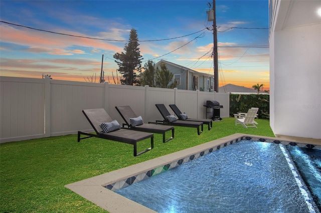 103 4th St N Unit A, Bradenton Beach, FL 34217 - pool at dusk with grilling area