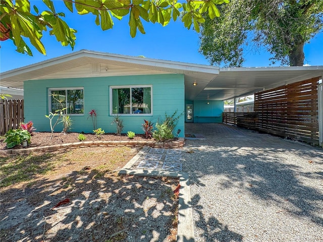 302 Pavonia Rd, Nokomis, FL 34275 - view of front facade with driveway and a carport