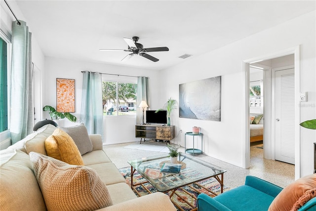 302 Pavonia Rd, Nokomis, FL 34275 - living room with a ceiling fan, speckle patterned floor, and baseboards