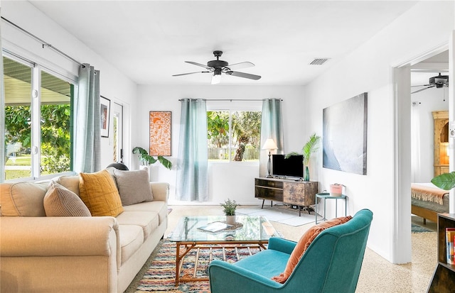 302 Pavonia Rd, Nokomis, FL 34275 - living room with ceiling fan and speckled floor