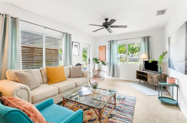 302 Pavonia Rd, Nokomis, FL 34275 - living room featuring a ceiling fan and speckle patterned floor