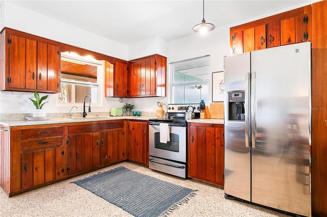 302 Pavonia Rd, Nokomis, FL 34275 - kitchen with stainless steel appliances, a sink, light countertops, and dark aggregate flooring