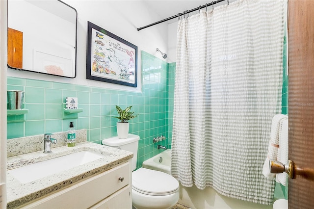 302 Pavonia Rd, Nokomis, FL 34275 - bathroom featuring toilet, shower / tub combo, vanity, and tile walls