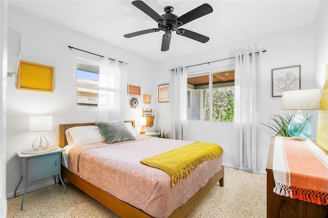 302 Pavonia Rd, Nokomis, FL 34275 - bedroom with speckle patterned floor, multiple windows, and baseboards