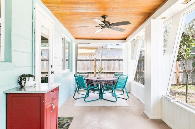 302 Pavonia Rd, Nokomis, FL 34275 - sunroom with wood ceiling, ceiling fan, radiator, and outdoor dining area