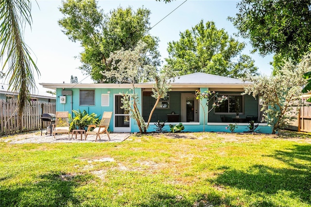 302 Pavonia Rd, Nokomis, FL 34275 - rear view of house featuring a sunroom