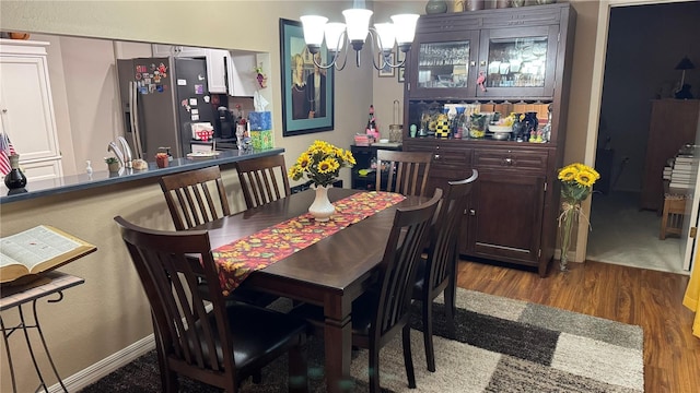 2841 74th St W Unit 2841, Bradenton, FL 34209 - dining space with wood finished floors and a chandelier