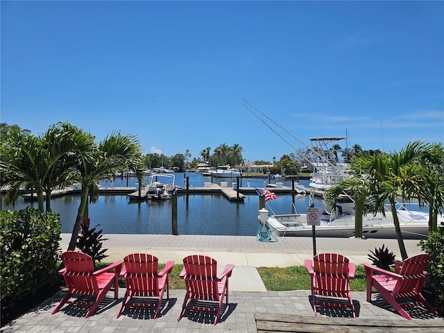 7150 N Tamiami Trl Unit C100, Sarasota, FL 34243 - view of patio / terrace featuring a boat dock and a water view