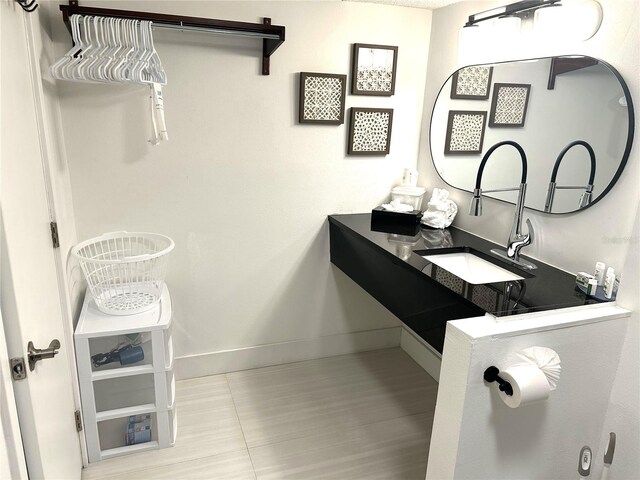 7150 N Tamiami Trl Unit C100, Sarasota, FL 34243 - bathroom with a sink and baseboards