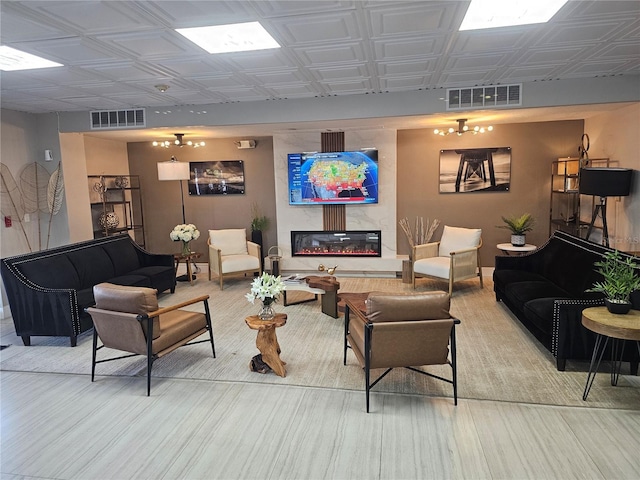 7150 N Tamiami Trl Unit C100, Sarasota, FL 34243 - living room with an ornate ceiling, baseboards, and a large fireplace