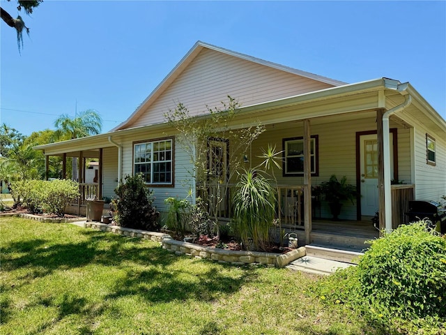 3828 6th Ave W, Palmetto, FL 34221 - view of front facade with covered porch and a front yard
