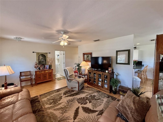 3828 6th Ave W, Palmetto, FL 34221 - living room with ceiling fan and wood finished floors