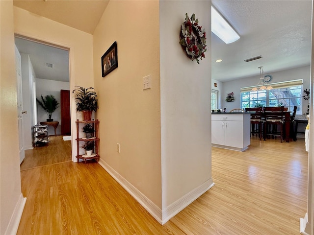 3828 6th Ave W, Palmetto, FL 34221 - hallway with light wood-type flooring and baseboards