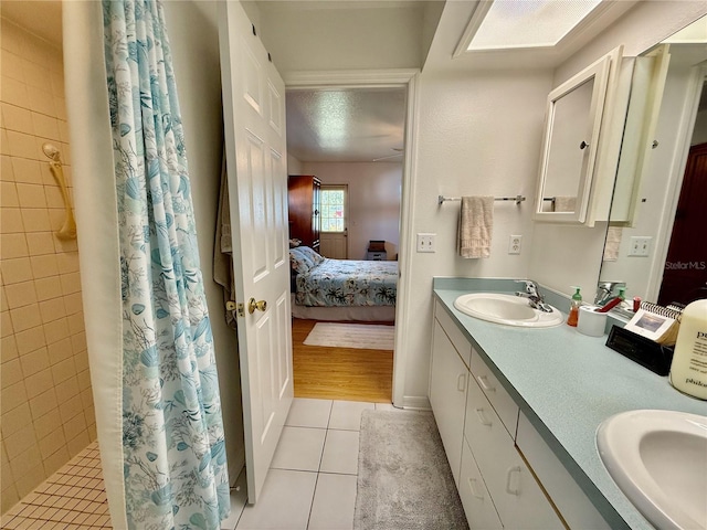 3828 6th Ave W, Palmetto, FL 34221 - ensuite bathroom with tile patterned floors, double vanity, and tiled shower